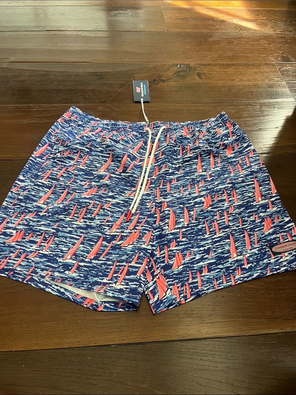 Vineyard Vines Navy Swim Trunks with Coral Sailboat Print